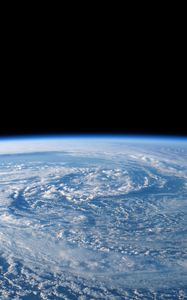 Preview wallpaper earth, planet, clouds, funnel, space