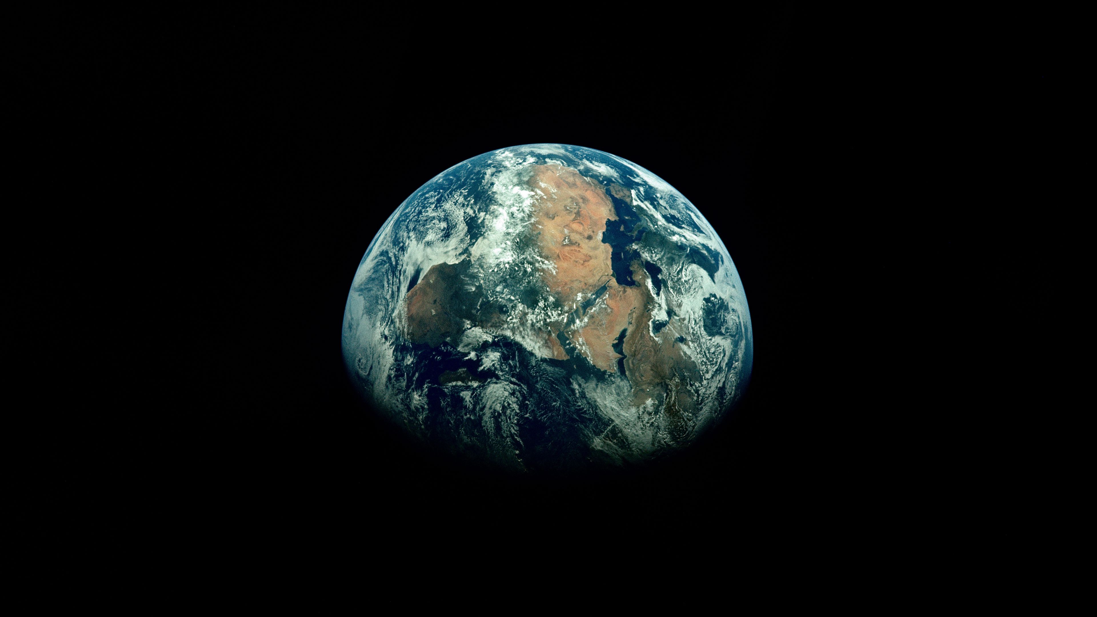 3840x2160 Wallpaper earth, planet, shadow, black, space