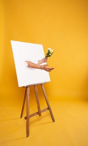 Preview wallpaper easel, canvas, hands, flowers, illusion, installation