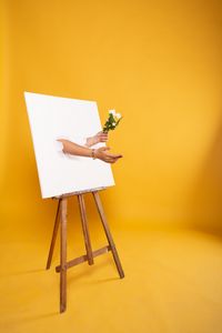 Preview wallpaper easel, canvas, hands, flowers, illusion, installation