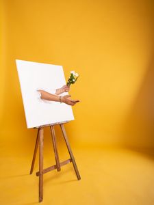 Preview wallpaper easel, canvas, hands, flowers, illusion, installation