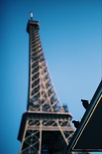 Preview wallpaper eiffel tower, pigeons, roof, blur