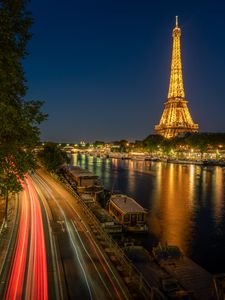 Preview wallpaper eiffel tower, tower, river, road, long exposure