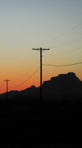 Preview wallpaper electric poles, mountains, silhouettes, nature, dark