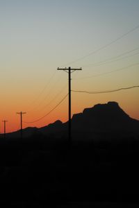 Preview wallpaper electric poles, mountains, silhouettes, nature, dark