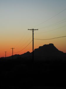 Preview wallpaper electric poles, mountains, silhouettes, nature, dark