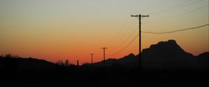 Preview wallpaper electric poles, mountains, silhouettes, nature, dark