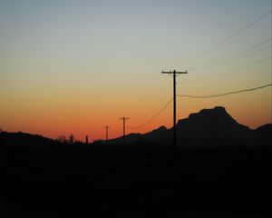 Preview wallpaper electric poles, mountains, silhouettes, nature, dark