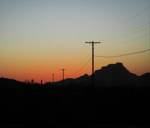 Preview wallpaper electric poles, mountains, silhouettes, nature, dark