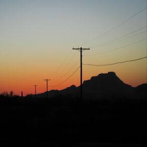 Preview wallpaper electric poles, mountains, silhouettes, nature, dark