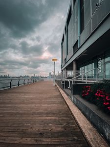 Preview wallpaper embankment, lantern, city, pier, wooden