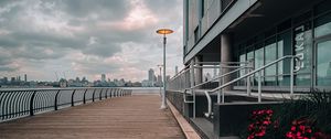 Preview wallpaper embankment, lantern, city, pier, wooden