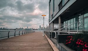 Preview wallpaper embankment, lantern, city, pier, wooden