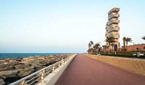 Preview wallpaper embankment, palm trees, coast, city