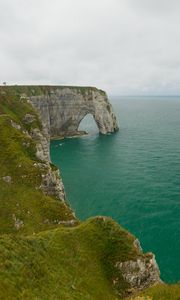 Preview wallpaper etretat cliffs, rocks, arch, sea, plants, clouds, nature, france