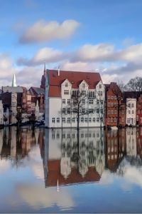 Preview wallpaper europe, buildings, trees, water, reflection, sky, clouds