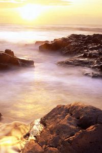 Preview wallpaper evaporation, stony coast, rising, sun, horizon, fog