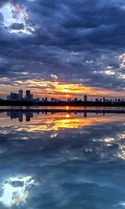 Preview wallpaper evening, decline, city, island, distance, coast, clouds, reflection