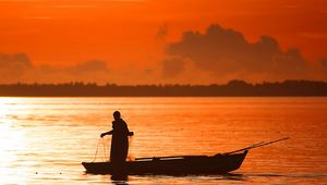 Preview wallpaper evening, decline, orange, person, boat, fishing, networks, outlines