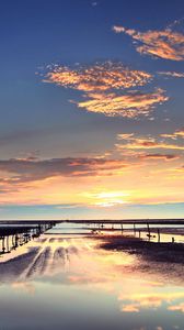 Preview wallpaper evening, outflow, stakes, sand, water