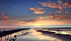 Preview wallpaper evening, outflow, stakes, sand, water