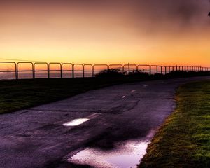 Preview wallpaper evening, park, quay, fence, road, asphalt, lawn