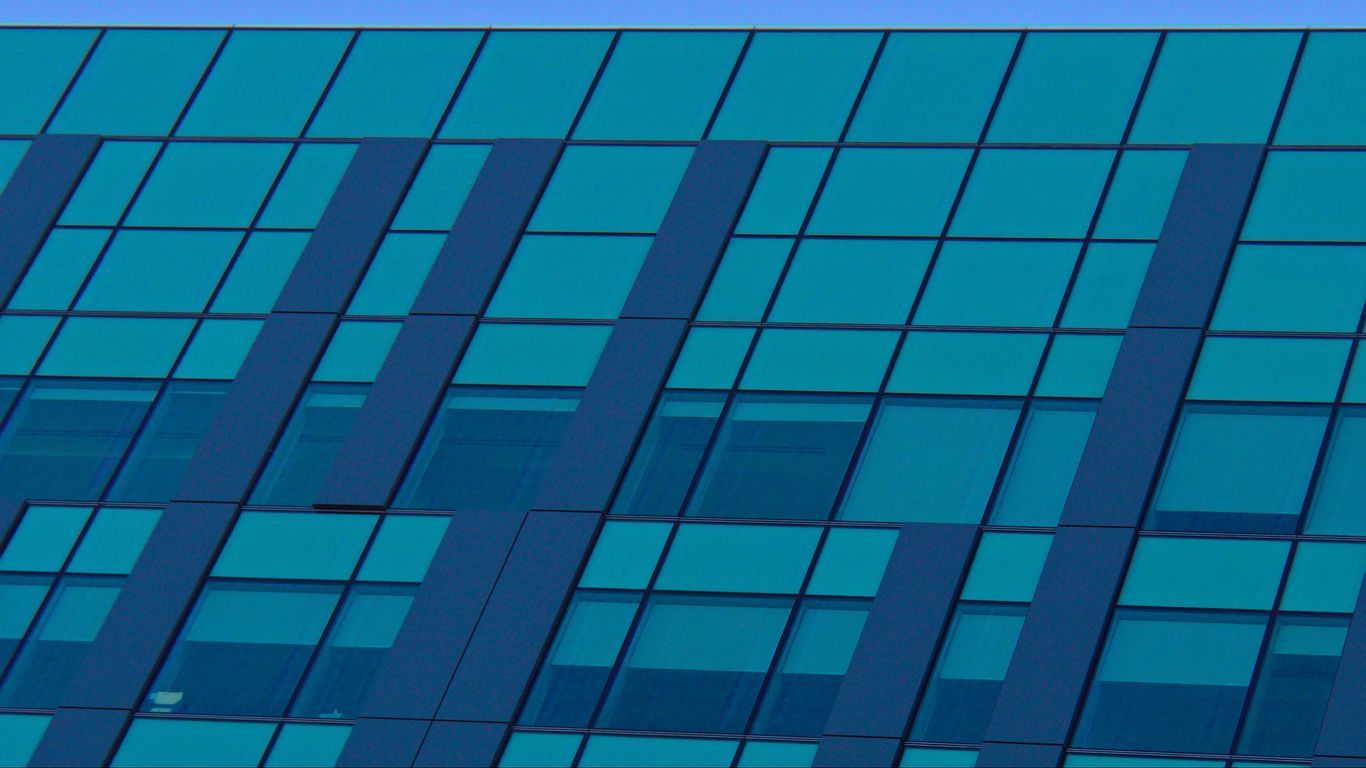 Download wallpaper 1366x768 facade, building, windows, glass, blue ...