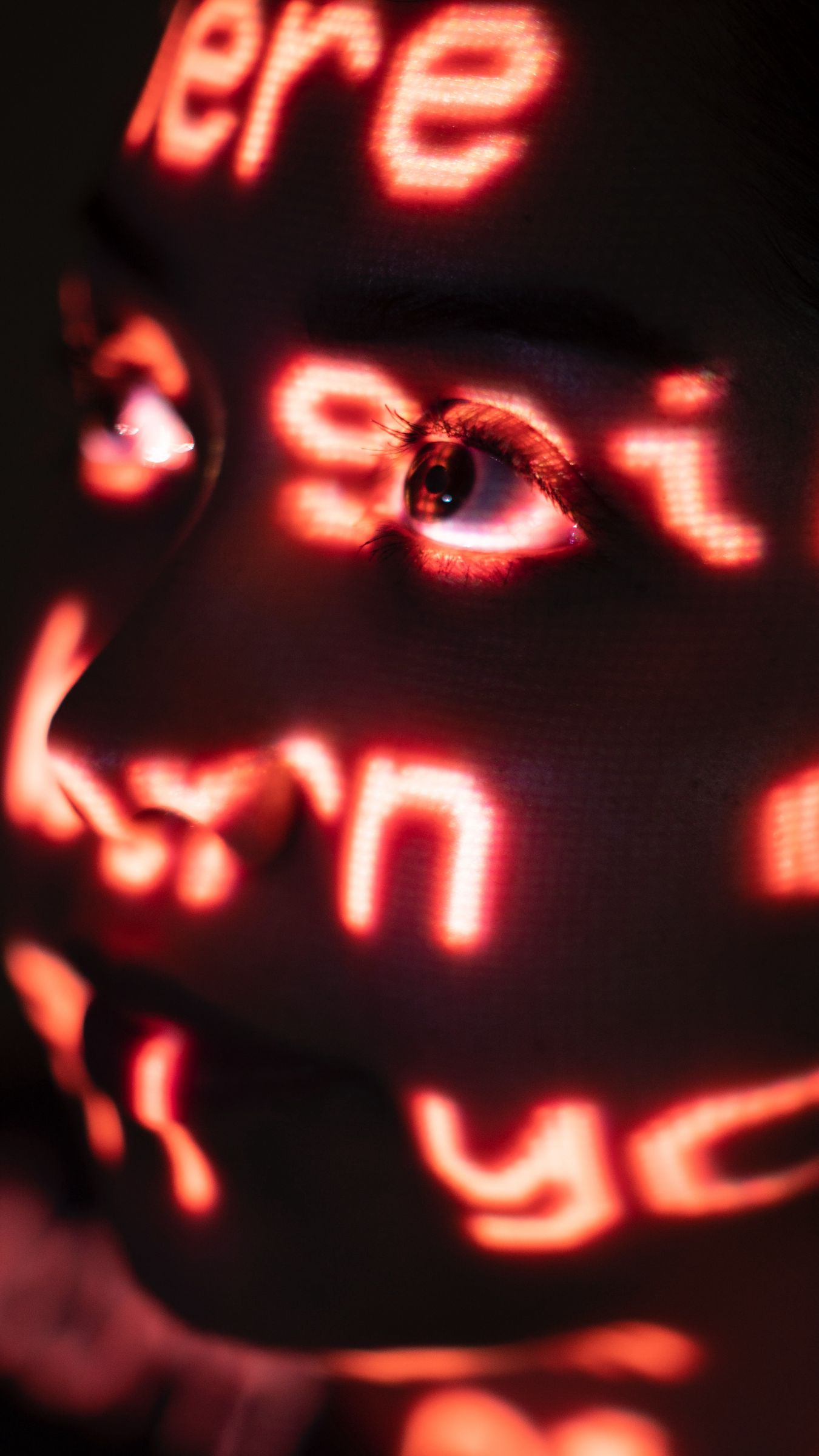 1350x2400 Wallpaper face, light, letters, red, projection