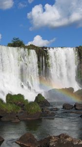 Preview wallpaper falls, rocks, stones, rainbow, sky, clouds