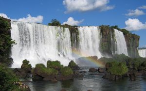 Preview wallpaper falls, rocks, stones, rainbow, sky, clouds