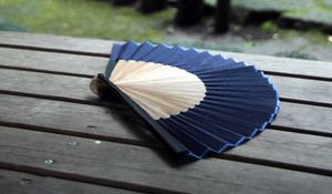 Preview wallpaper fan, folds, wood