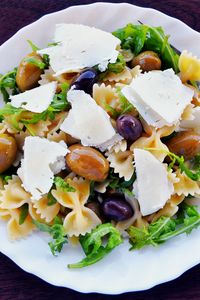 Preview wallpaper farfalle, olives, cheese, arugula, lettuce