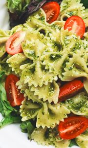 Preview wallpaper farfalle, pasta, salad, sauce, cherry tomatoes