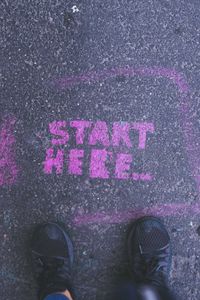 Preview wallpaper feet, asphalt, inscription, start