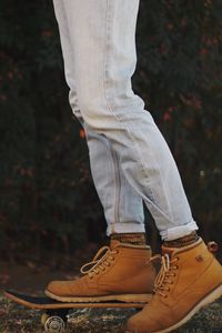 Preview wallpaper feet, boots, skateboard, jeans