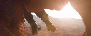 Preview wallpaper feet, cave, rock, mountain, sunset