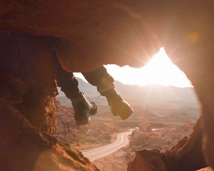 Preview wallpaper feet, cave, rock, mountain, sunset