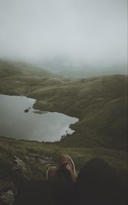 Preview wallpaper feet, lake, fog, hills, slope