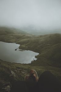 Preview wallpaper feet, lake, fog, hills, slope