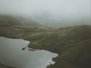 Preview wallpaper feet, lake, fog, hills, slope