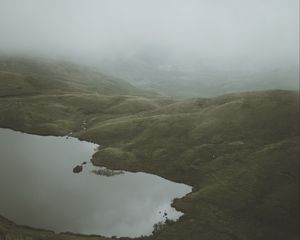 Preview wallpaper feet, lake, fog, hills, slope