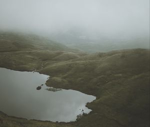 Preview wallpaper feet, lake, fog, hills, slope