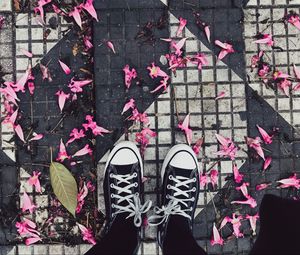 Preview wallpaper feet, sneakers, flowers, leaves