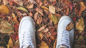 Preview wallpaper feet, sneakers, foliage, autumn