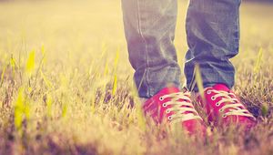 Preview wallpaper feet, sneakers, grass, light, shoes