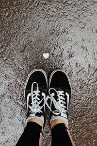 Preview wallpaper feet, sneakers, heart, asphalt, wet