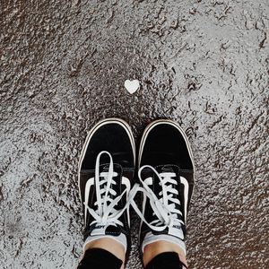 Preview wallpaper feet, sneakers, heart, asphalt, wet