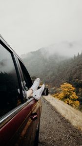 Preview wallpaper feet, sneakers, journey, fog, car
