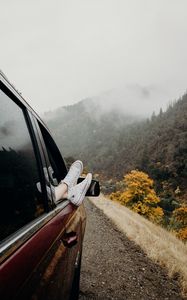 Preview wallpaper feet, sneakers, journey, fog, car