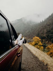 Preview wallpaper feet, sneakers, journey, fog, car